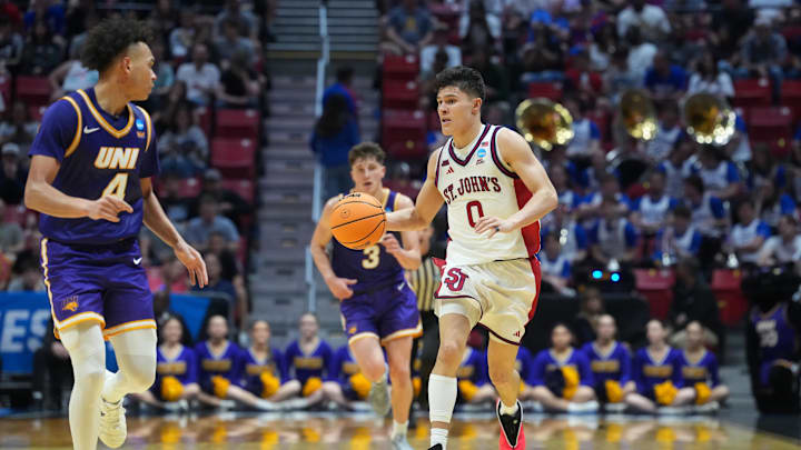Mar 20, 2026; San Diego, CA, USA; St. John's basketball guard Dylan Darling (0) controls the ball against Northern Iowa Panthers guard Redek Born (0) in the second half during a first round game of the men's 2026 NCAA Tournament at Viejas Arena.