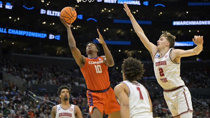 Mar 30, 2024; Los Angeles, CA, USA; Clemson Tigers forward RJ Godfrey (10) shoots against Alabama Crimson Tide forward Grant Nelson (2) in the first half in the finals of the West Regional of the 2024 NCAA Tournament at Crypto.com Arena. Mandatory Credit: Jayne Kamin-Oncea-Imagn Images