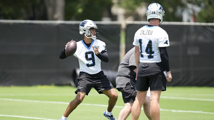 Jun 11, 2025; Charlotte, NC, USA; Carolina Panthers quarterback Andy Dalton (14) watches quarterback Bryce Young (9) throw during minicamp at Bank of America Stadium. Mandatory Credit: Jim Dedmon-Imagn Images
