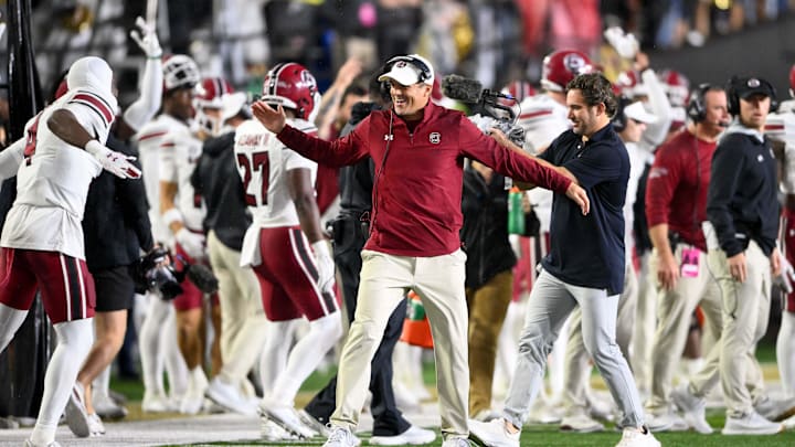 Nov 9, 2024; Nashville, Tennessee, USA;  South Carolina Gamecocks head coach Shane Beamer celebrates the win with defensive back Vicari Swain (4) against the Vanderbilt Commodores during the second half at FirstBank Stadium. Mandatory Credit: Steve Roberts-Imagn Images