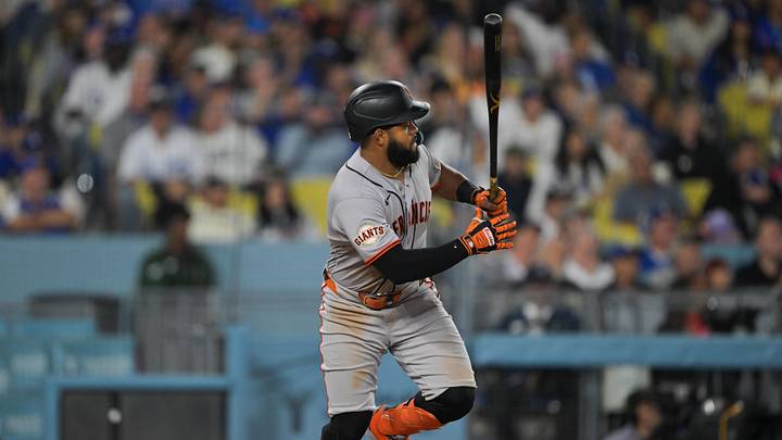 May 11, 2026; Los Angeles, California, USA; San Francisco Giants left fielder Heliot Ramos (17) doubles in two runs in the sixth inning against the Los Angeles Dodgers at Dodger Stadium. 