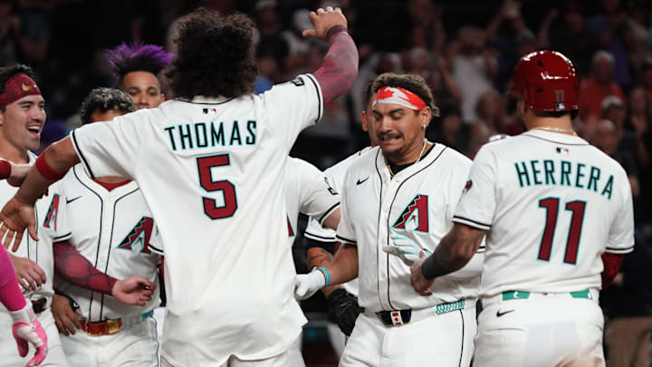 Jun 9, 2025; Phoenix, Arizona, USA; Arizona Diamondbacks first base Josh Naylor (22) celebrates with teammates after hitting a walk off grand slam home run against the Seattle Mariners in the eleventh inning at Chase Field. Mandatory Credit: Rick Scuteri-Imagn Images
