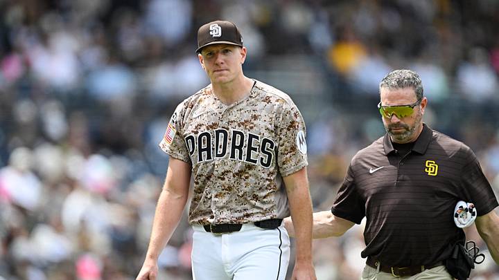 Apr 12, 2026; San Diego, California, USA; San Diego Padres starting pitcher Nick Pivetta (27), left, leaves the field with a trainer during the fourth inning against the Colorado Rockies at Petco Park. Mandatory Credit: Denis Poroy-Imagn Images Apr 12, 2026; San Diego, California, USA; San Diego Padres starting pitcher Nick Pivetta (27), left, leaves the field with a trainer during the fourth inning against the Colorado Rockies at Petco Park. Mandatory Credit: Denis Poroy-Imagn Images