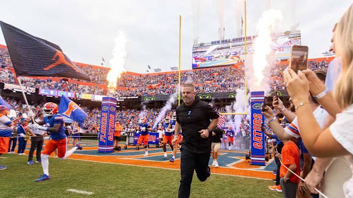 Florida Gators head coach Billy Napier runs onto the field before the start of the game at Ben Hill Griffin Stadium in Gainesville, FL on Saturday, September 7, 2024 against the Samford Bulldogs. The Gators won 45-7. [Doug Engle/Gainesville Sun]