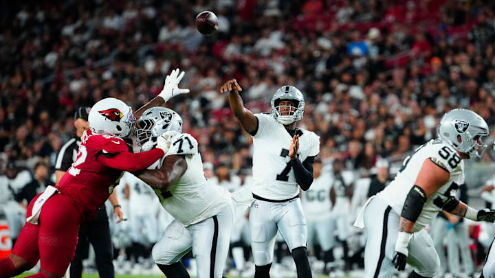 Raiders quarterback Geno Smith (7) throws a pass against the Cardinals during a preseason game at State Farm Stadium in Glendale on Aug. 23, 2025.