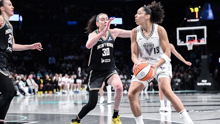 May 29, 2025; Brooklyn, New York, USA; Golden State Valkyries forward Janelle Salaun (13) looks to pass the ball as New York Liberty forward Breanna Stewart (30) defends during the first half at Barclays Center. Mandatory Credit: John Jones-Imagn Images