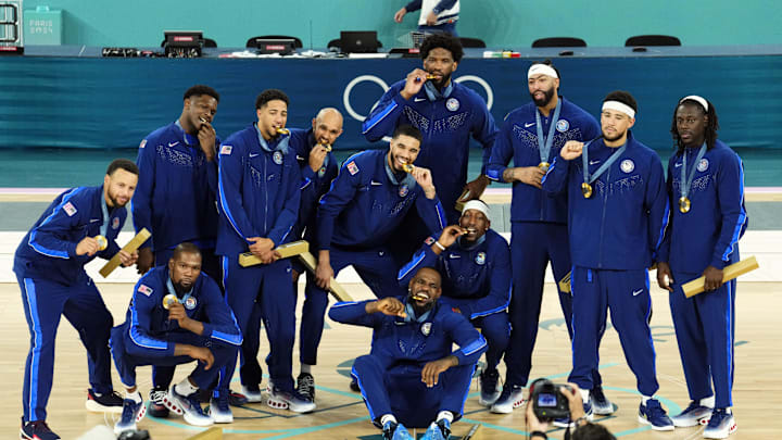 Team USA poses with their gold medals after beating Team France at the Paris Olympics.