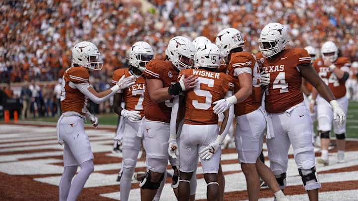 Texas Longhorns celebrate after running back Quintrevion Wisner (5) runs for a touchdown in the first half against the Vanderbilt Commodores at Darrell K Royal-Texas Memorial Stadium. Mandatory Credit: Scott Wachter-Imagn Images