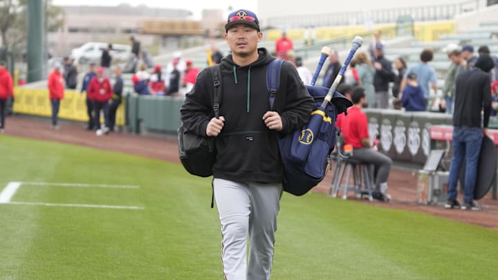 Mar 1, 2023; Tempe, Arizona, USA; Milwaukee Brewers first baseman Keston Hiura (18) arrives to the
