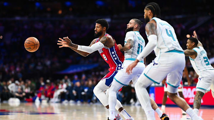 Dec 20, 2024; Philadelphia, Pennsylvania, USA; Philadelphia 76ers forward Paul George (8) passes the ball against Charlotte Hornets forward Cody Martin (11) in the third quarter at Wells Fargo Center. Mandatory Credit: Kyle Ross-Imagn Images