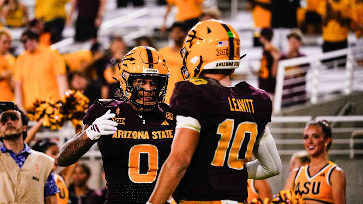 Aug 30, 2025; Tempe, Arizona, USA;  Arizona State Sun Devils wide receiver Jordyn Tyson (0) and  Arizona State Sun Devils quarterback Sam Leavitt (10) celebrates a touchdown in the fourth quarter between Arizona State Sun Devils and Northern Arizona Lumberjacks at Mountain America Stadium. Mandatory Credit: Arianna Grainey-Imagn Images