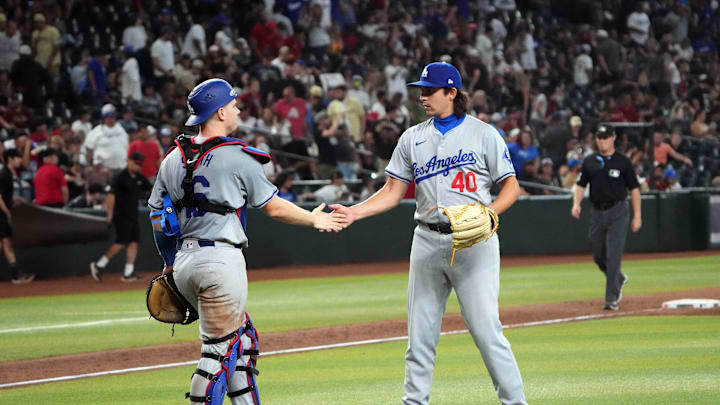 Sep 2, 2024; Phoenix, Arizona, USA; Los Angeles Dodgers pitcher Brent Honeywell (40) and Los Angeles Dodgers catcher Will Smith (16) celebrate after defeating the Arizona Diamondbacks at Chase Field. Mandatory Credit: Joe Camporeale-Imagn Images