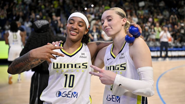 Sep 11, 2025; Arlington, Texas, USA; Dallas Wings guard Aziaha James (10) and guard Paige Bueckers (5) pose for a photo after the game against the Phoenix Mercury at College Park Center. Mandatory Credit: Jerome Miron-Imagn Images