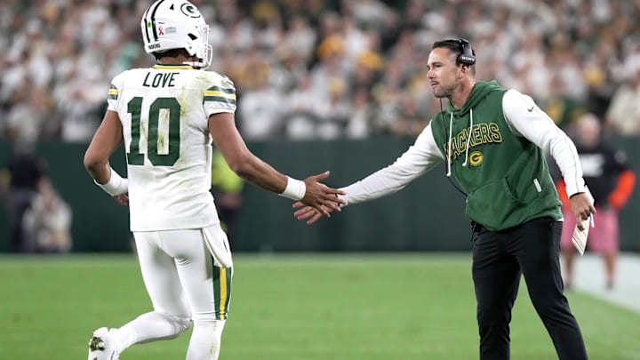 Green Bay Packers quarterback Jordan Love (10) in congratulated by head coach Matt LaFleur after throwing a touchdown pass during the fourth quarter of their game Thursday, September 11, 2025 at Lambeau Field in Green Bay, Wisconsin. The Green Bay Packers beat the Washington Commanders 27-18