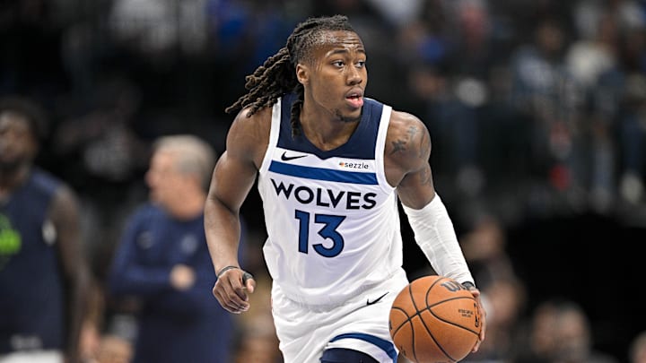 Mar 30, 2026; Dallas, Texas, USA; Minnesota Timberwolves guard Ayo Dosunmu (13) brings the ball up court against the Dallas Mavericks during the second quarter at the American Airlines Center. Mandatory Credit: Jerome Miron-Imagn Images