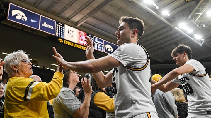 Nov 20, 2025; Iowa City, Iowa, USA; Iowa Hawkeyes guard Brendan Hausen (15) and forward Trey Thompson (20) greet fans after the game against the Chicago State Cougars at Carver-Hawkeye Arena. Mandatory Credit: Jeffrey Becker-Imagn Images Nov 20, 2025; Iowa City, Iowa, USA; Iowa Hawkeyes guard Brendan Hausen (15) and forward Trey Thompson (20) greet fans after the game against the Chicago State Cougars at Carver-Hawkeye Arena. Mandatory Credit: Jeffrey Becker-Imagn Images
