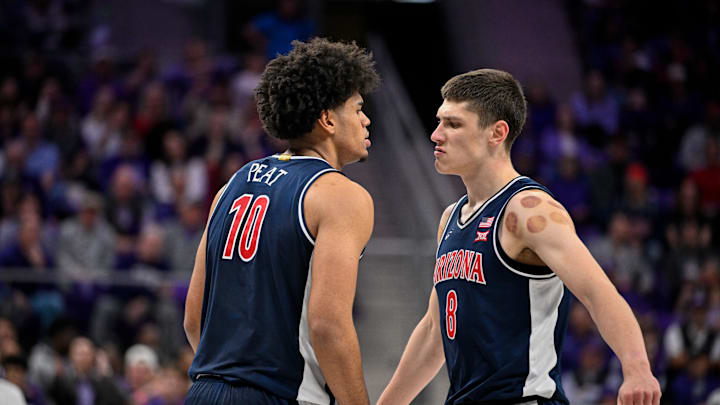 Jan 10, 2026; Fort Worth, Texas, USA; Arizona Wildcats forward Koa Peat (10) and forward Ivan Kharchenkov (8) celebrate during the game between the Horned Frogs and the Wildcats at Ed and Rae Schollmaier Arena. Mandatory Credit: Jerome Miron-Imagn Images