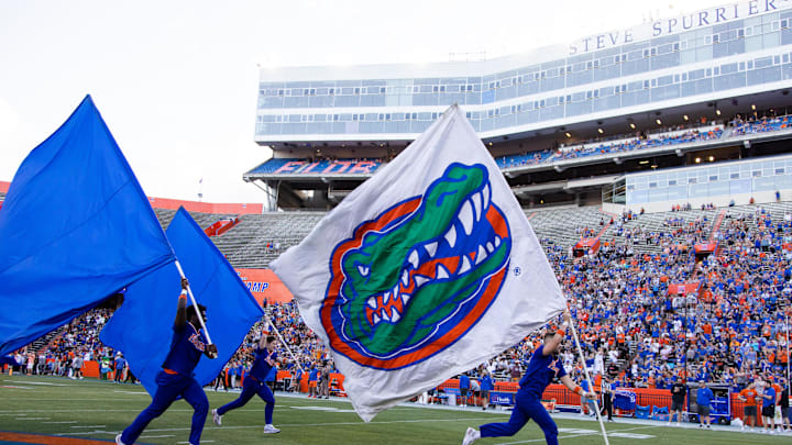 Gator fans cheer as the flags are brought onto the field during the first half of the University of