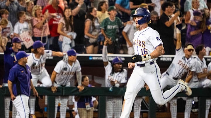 Jun 18, 2025; Omaha, Neb, USA; LSU Tigers designated hitter Ethan Frey (16) scores against the Arkansas Razorbacks during the ninth inning at Charles Schwab Field. Mandatory Credit: Dylan Widger-Imagn Images Jun 18, 2025; Omaha, Neb, USA; LSU Tigers designated hitter Ethan Frey (16) scores against the Arkansas Razorbacks during the ninth inning at Charles Schwab Field. Mandatory Credit: Dylan Widger-Imagn Images