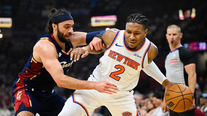 May 23, 2026; Cleveland, Ohio, USA; New York Knicks guard Miles McBride (2) moves the ball while defended by Cleveland Cavaliers guard Max Strus (2) in the third quarter during game three of the eastern conference finals for the 2026 NBA playoffs at Rocket Arena. Mandatory Credit: David Richard-Imagn Images
