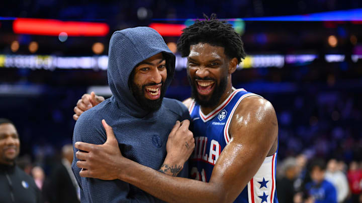 Feb 4, 2025; Philadelphia, Pennsylvania, USA; Dallas Mavericks forward Anthony Davis (3) reacts with Philadelphia 76ers center Joel Embiid (21) after the game at Wells Fargo Center. Mandatory Credit: Kyle Ross-Imagn Images