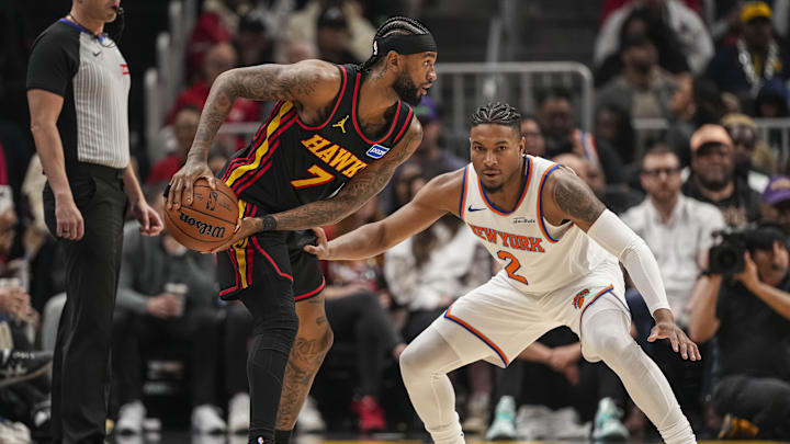 Apr 6, 2026; Atlanta, Georgia, USA; Atlanta Hawks guard Nickeil Alexander-Walker (7) protects the ball from New York Knicks guard Miles McBride (2) during the first half at State Farm Arena. Mandatory Credit: Dale Zanine-Imagn Images