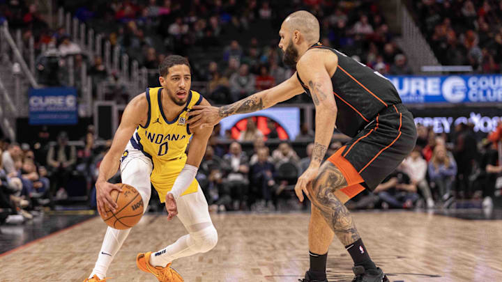 Mar 20, 2024; Detroit, Michigan, USA; Detroit Pistons guard Evan Fournier (31) defends against