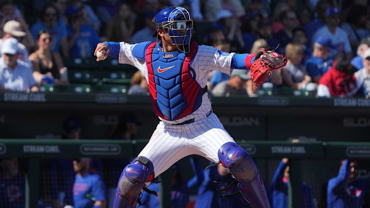 Chicago Cubs catcher Miguel Amaya warms up during the first inning of a 2025 spring training game.