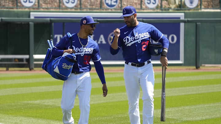 Mar 24, 2023; Phoenix, Arizona, USA; Los Angeles Dodgers right fielder Mookie Betts (50) and designated hitter J.D. Martinez (28) walk into together before a game against the Milwaukee Brewers at Camelback Ranch-Glendale. Mandatory Credit: Rick Scuteri-Imagn Images