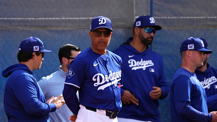Feb 16, 2025; Glendale, AZ, USA; Los Angeles Dodgers manager Dave Roberts (30) looks on during a Spring Training workout at Camelback Ranch. Mandatory Credit: Joe Camporeale-Imagn Images