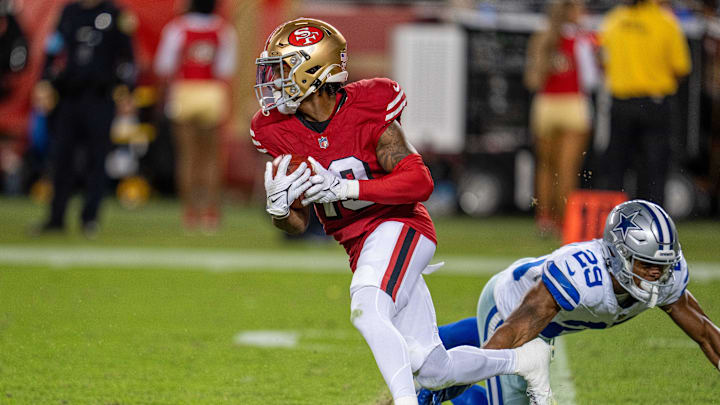 Oct 27, 2024; Santa Clara, California, USA; San Francisco 49ers wide receiver Jacob Cowing (19) on a runback against Dallas Cowboys cornerback C.J. Goodwin (29) at Levi's Stadium. Mandatory Credit: Neville E. Guard-Imagn Images