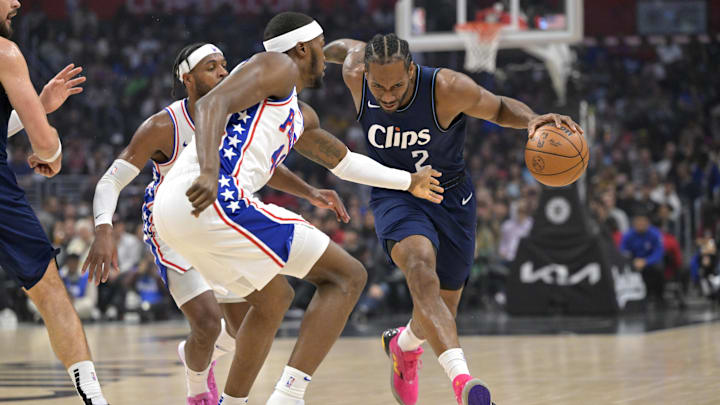 Los Angeles Clippers forward Kawhi Leonard (2) is fouled by Philadelphia 76ers forward Paul Reed (44) as he drives to the basket in the first half at Crypto.com Arena. Mandatory Credit: Jayne Kamin-Oncea-Imagn Images