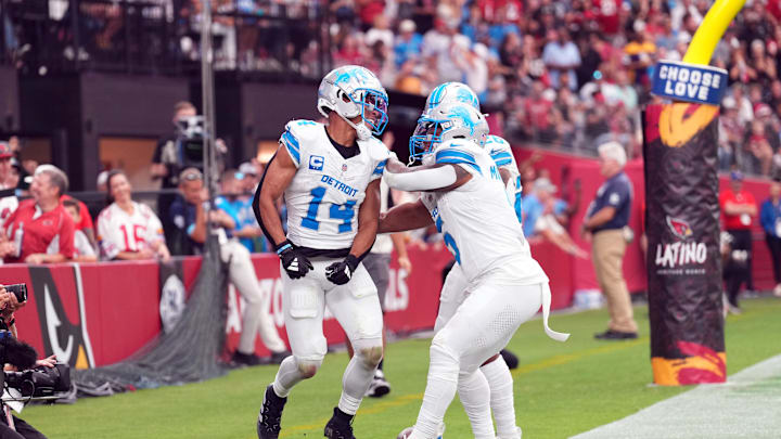 Sep 22, 2024; Glendale, Arizona, USA; Detroit Lions wide receiver Amon-Ra St. Brown (14) celebrates a touchdown against the Arizona Cardinals during the first half at State Farm Stadium. Mandatory Credit: Joe Camporeale-Imagn Images