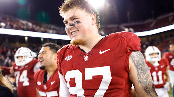 Nov 22, 2025; Stanford, California, USA; Stanford Cardinal defensive lineman Zach Rowell (97) reacts after taking possession of the axe after the game against the California Golden Bears at Stanford Stadium. Mandatory Credit: Sergio Estrada-Imagn Images