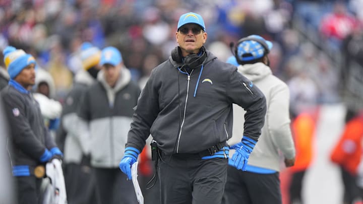 Dec 28, 2024; Foxborough, Massachusetts, USA; Los Angeles Chargers head coach Jim Harbaugh looks up at the scoreboard from the sidelines during the first half against the New England Patriots at Gillette Stadium. Mandatory Credit: Gregory Fisher-Imagn Images