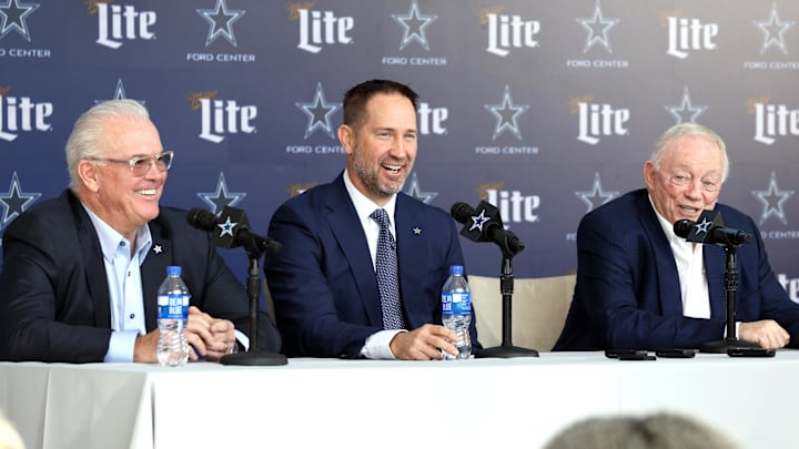 Dallas Cowboys CEO Stephen Jones, coach Brian Schottenheimer and owner Jerry Jones speak at a press conference.