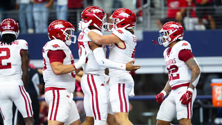 Sep 28, 2024; Arlington, Texas, USA;  Arkansas Razorbacks wide receiver Isaac TeSlaa (4) celebrates with Arkansas Razorbacks quarterback Taylen Green (10) after scoring a touchdown during the first quarter against the Texas A&M Aggies at AT&T Stadium. Mandatory Credit: Kevin Jairaj-Imagn Images