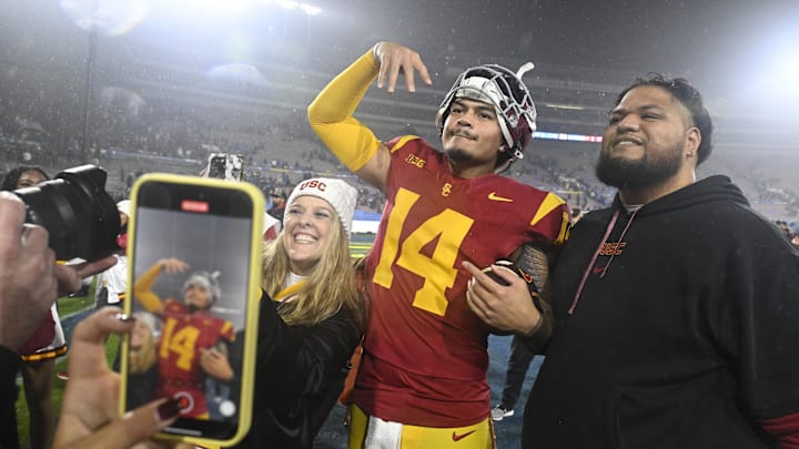 Nov 23, 2024; Pasadena, California, USA;  USC Trojans quarterback Jayden Maiava (14) celebrates the win over UCLA at Rose Bowl. Mandatory Credit: Robert Hanashiro-Imagn Images