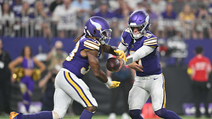 Sep 14, 2025; Minneapolis, Minnesota, USA; Minnesota Vikings quarterback J.J. McCarthy (9) hands off the ball to Minnesota Vikings running back Aaron Jones Sr. (33) during the first half at U.S. Bank Stadium. Mandatory Credit: Jeffrey Becker-Imagn Images