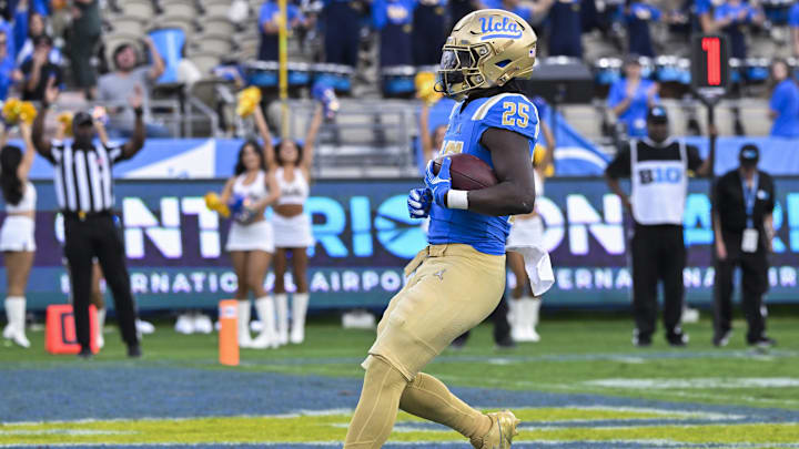 Nov 30, 2024; Pasadena, California, USA; UCLA Bruins running back T.J. Harden (25) scores a touchdown on a short run against the Fresno State Bulldogs in the third quarter at Rose Bowl. Mandatory Credit: Robert Hanashiro-Imagn Images Nov 30, 2024; Pasadena, California, USA; UCLA Bruins running back T.J. Harden (25) scores a touchdown on a short run against the Fresno State Bulldogs in the third quarter at Rose Bowl. Mandatory Credit: Robert Hanashiro-Imagn Images