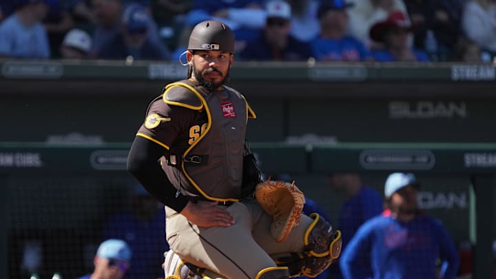 Mar 4, 2025; Mesa, Arizona, USA; San Diego Padres catcher Luis Campusano (12) looks for a sign against the Chicago Cubs in the third inning at Sloan Park. Mar 4, 2025; Mesa, Arizona, USA; San Diego Padres catcher Luis Campusano (12) looks for a sign against the Chicago Cubs in the third inning at Sloan Park.
