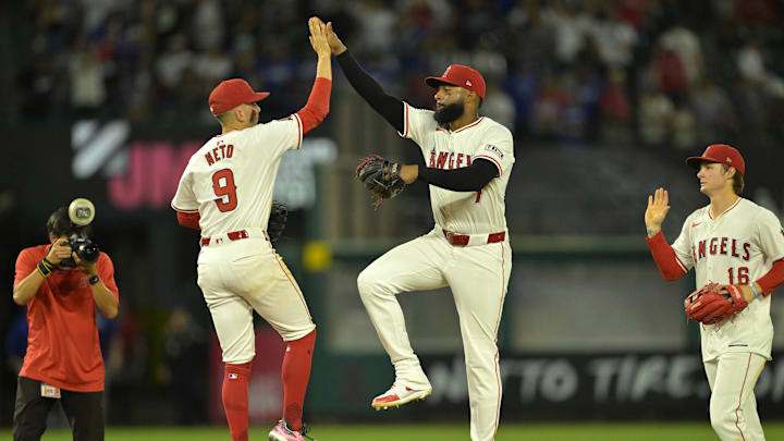 Sep 4, 2024; Anaheim, California, USA; Los Angeles Angels shortstop Zach Neto (9) and right fielder Jo Adell (7) celebrate after the final out of the ninth inning defeating the Los Angeles Dodgers at Angel Stadium. Mandatory Credit: Jayne Kamin-Oncea-Imagn Images