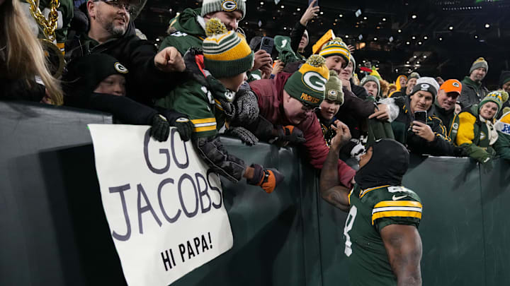 Green Bay Packers running back Josh Jacobs (8) greets fans following a victory over the New Orleans Saints. Green Bay Packers running back Josh Jacobs (8) greets fans following a victory over the New Orleans Saints.