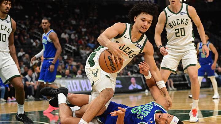 Oct 5, 2026; Milwaukee, Wisconsin, USA; Milwaukee Bucks guard Brayden Burries (0) reaches for a loose ball against Minnesota Timberwolves forward Enrique Freeman (25) in the third quarter at Fiserv Forum. Mandatory Credit: Benny Sieu-Imagn Images Oct 5, 2026; Milwaukee, Wisconsin, USA; Milwaukee Bucks guard Brayden Burries (0) reaches for a loose ball against Minnesota Timberwolves forward Enrique Freeman (25) in the third quarter at Fiserv Forum. Mandatory Credit: Benny Sieu-Imagn Images