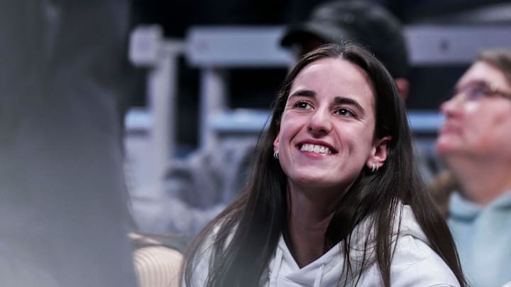 Indiana Fever guard Caitlin Clark (22) smiles Thursday, March 6, 2025, in a round two game at the 2025 TIAA Big Ten Women's Basketball Tournament between the Iowa Hawkeyes and the Michigan State Spartans at Gainbridge Fieldhouse in Indianapolis.