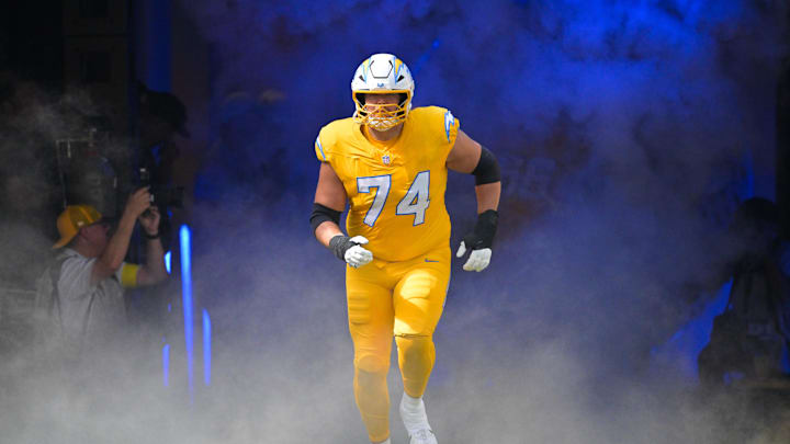 Oct 19, 2025; Inglewood, California, USA; Los Angeles Chargers offensive tackle Austin Deculus (74) enters the field before the game against the Indianapolis Colts at SoFi Stadium. Mandatory Credit: Jayne Kamin-Oncea-Imagn Images