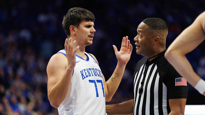 Nov 26, 2024; Lexington, Kentucky, USA; Kentucky Wildcats guard Kerr Kriisa (77) talks with a referee during the first half against the Western Kentucky Hilltoppers at Rupp Arena at Central Bank Center. Mandatory Credit: Jordan Prather-Imagn Images