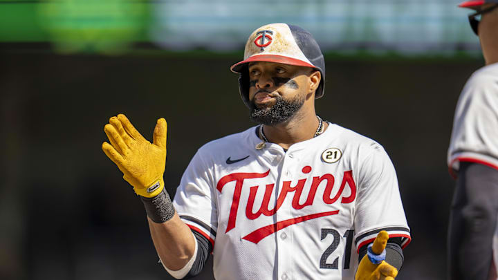 Sep 15, 2024; Minneapolis, Minnesota, USA; Minnesota Twins first baseman Carlos Santana (21) celebrates after hitting a single against the Cincinnati Reds in the fourth inning at Target Field. Mandatory Credit: Jesse Johnson-Imagn Images