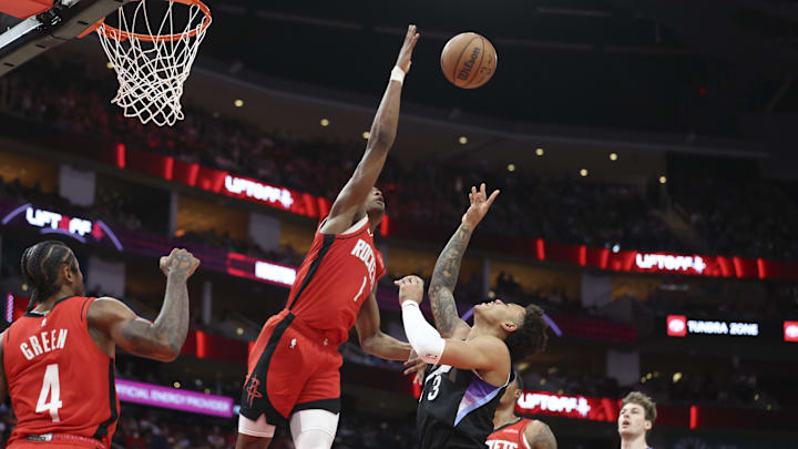 Apr 2, 2025; Houston, Texas, USA; Houston Rockets forward Amen Thompson (1) attempts to block a shot by Utah Jazz guard Isaiah Collier (13) during the second quarter at Toyota Center. Mandatory Credit: Troy Taormina-Imagn Images Apr 2, 2025; Houston, Texas, USA; Houston Rockets forward Amen Thompson (1) attempts to block a shot by Utah Jazz guard Isaiah Collier (13) during the second quarter at Toyota Center. Mandatory Credit: Troy Taormina-Imagn Images