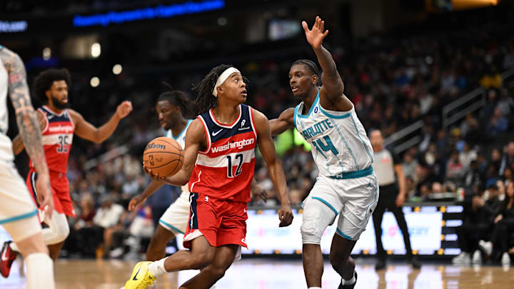 Oct 26, 2025; Washington, District of Columbia, USA; Washington Wizards guard Tre Johnson (12) drives the basket in front to Charlotte Hornets forward Moussa Diabate (14) during the first quarter at Capital One Arena. Mandatory Credit: Rafael Suanes-Imagn Images Oct 26, 2025; Washington, District of Columbia, USA; Washington Wizards guard Tre Johnson (12) drives the basket in front to Charlotte Hornets forward Moussa Diabate (14) during the first quarter at Capital One Arena. Mandatory Credit: Rafael Suanes-Imagn Images